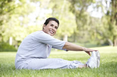 woman stretching in the grass