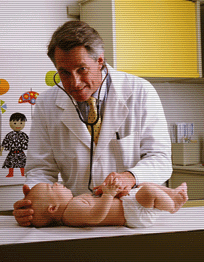 physician examining a baby