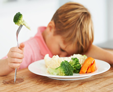 boy with veggies