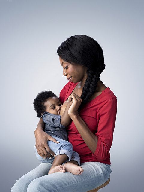 woman breastfeeding baby
