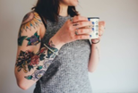 woman with tattoos on her arm