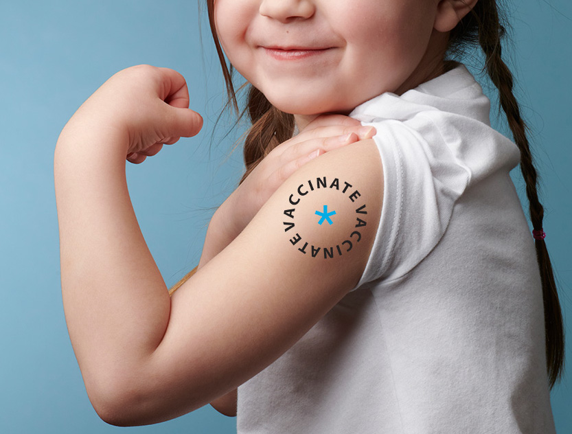 child showing vaccinate arm