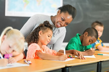 children and teacher in a classroom