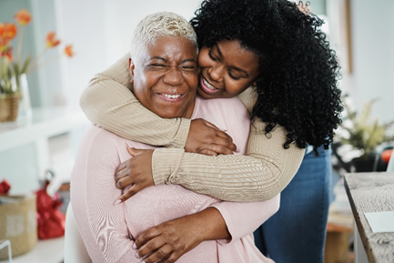 woman hugging another woman