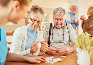 seniors putting together a puzzle