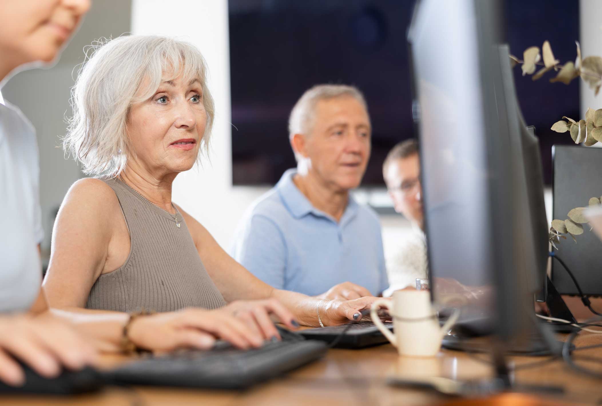 Older people looking at computers