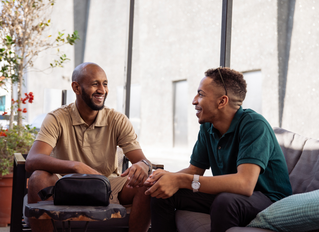 Two Black men having a fun conversation.