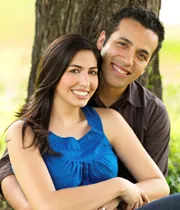 Couple sitting under a tree